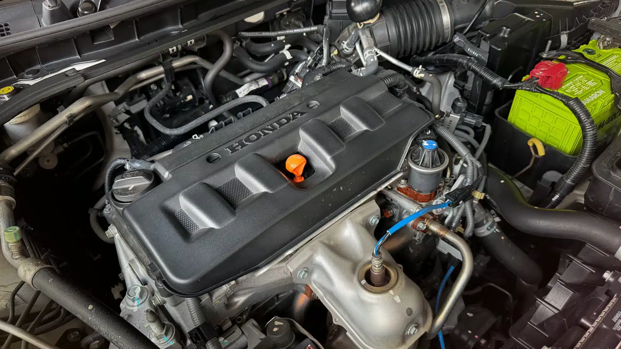 Professional Honda auto mechanic near me working on a vehicle in Mystic, CT shop