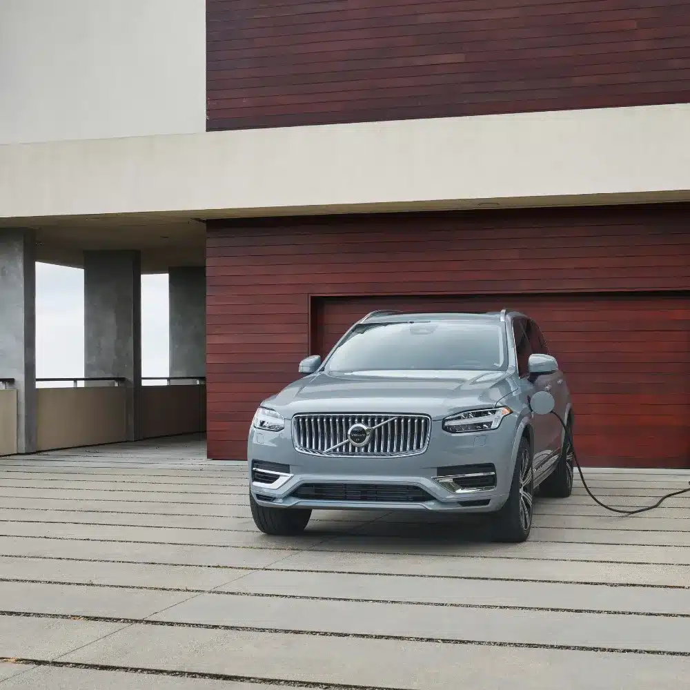 see-how-the-2026-volvo-xc90-trim-levels-compare-to-help-you-make-the-best-choice A stylish 2026 Volvo XC90 with various trim levels highlighted for comparison on a showroom floor.