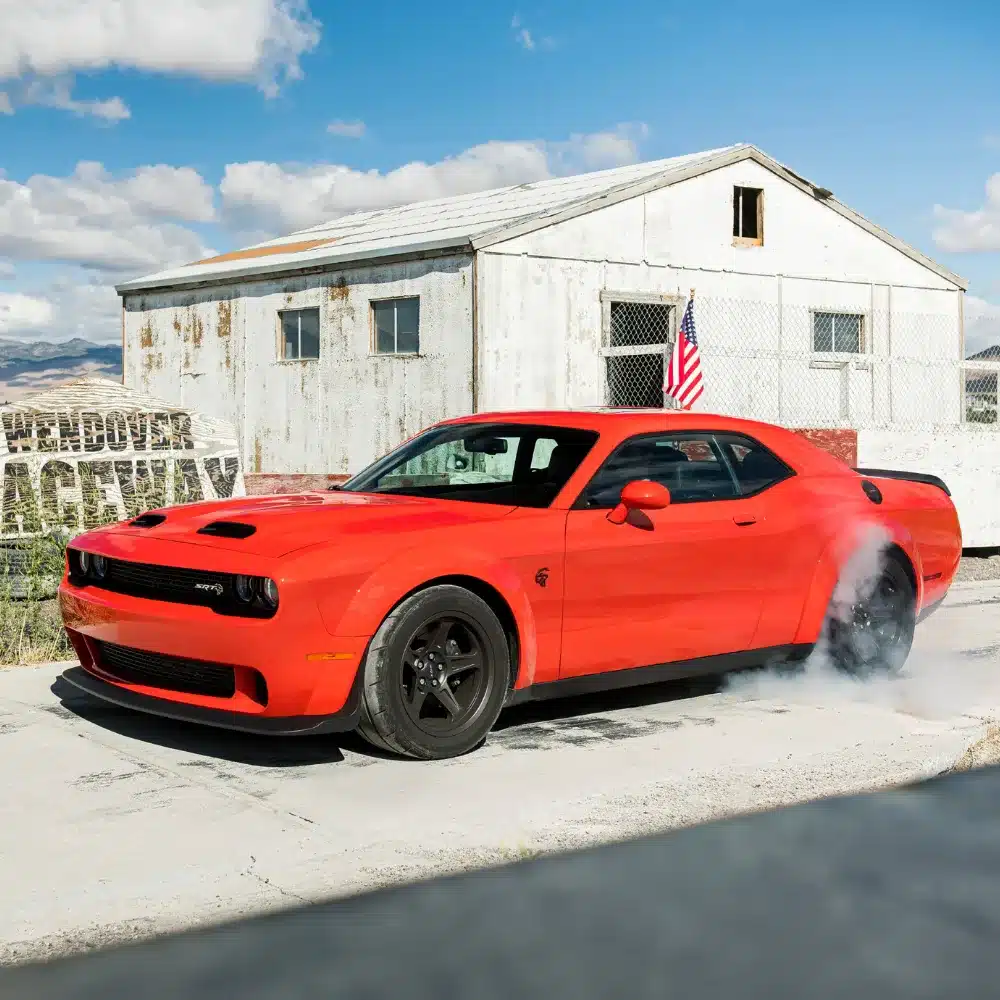 drive-home-a-certified-pre-owned-dodge-near-hartford-with-confidence-and-peace-of-mind A shiny Certified Pre-Owned Dodge sedan parked outside a dealership, ready for a test drive.