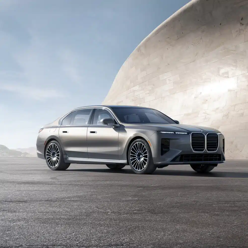 Luxury certified pre-owned BMW vehicles await discerning buyers at a Massachusetts dealership lot.